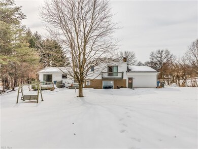 Rear of the home shows deck on the left, upper dec