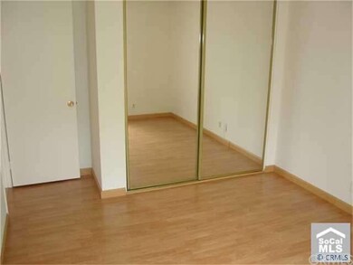 2nd Bedroom with Mirrored Wardrobe Doors & Laminat