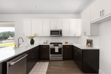 Kitchen featuring stainless steel appliances, a s