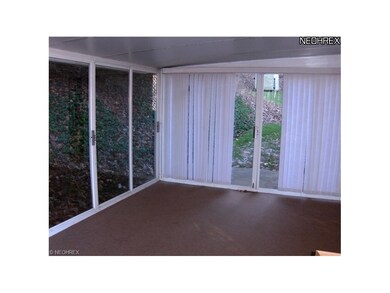 ENCLOSED 3 SEASON PATIO EXITS OFF THE FAMILY ROOM.