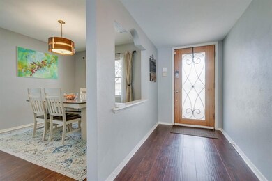 Front entry and dining area both with wood floorin