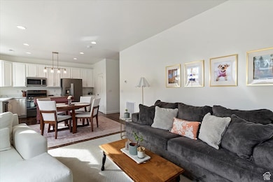 Living area with wood finished floors and recessed lighting