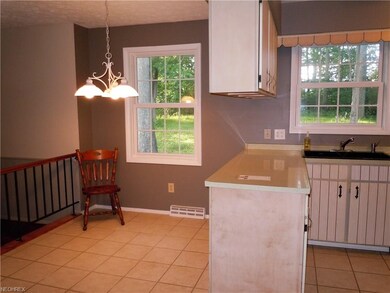 Bright and clean eat in kitchen, new sink, and new