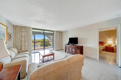 Living Room; Patio Doors To Screened Balcony; Door