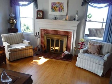 Cozy fireplace accents the living room.