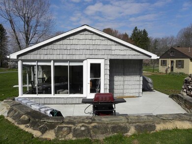 New Concrete Patio with Shed attached to Cottage!