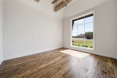Flex room with beamed ceiling.