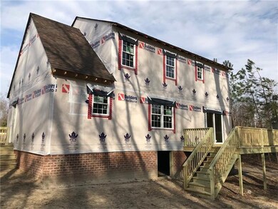 Rear of home with spacious deck on large lot