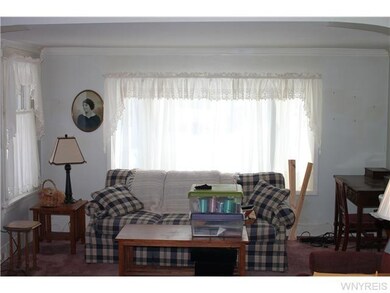 Living Room. Looking to street , bow window with s