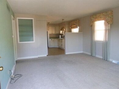 Large living room with guest coat closet and decor