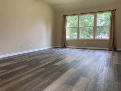 This spacious room features large windows allowing