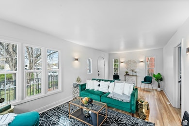 Living room featuring wood finished floors and baseboards