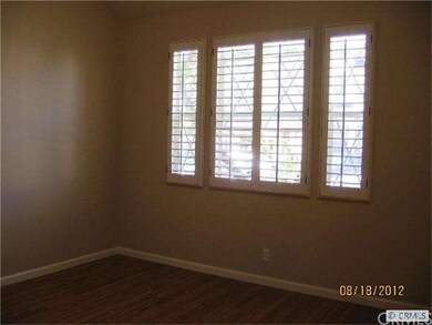 Freshly painted living Room with plantation shutte