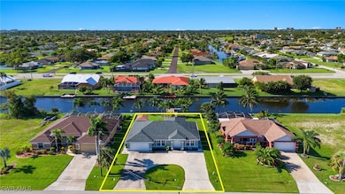 Birds eye view of property with a water view