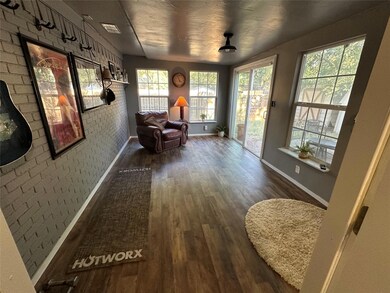 Doorway with dark hardwood / wood-style flooring