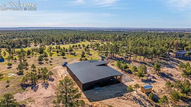 View from above of property featuring a forest