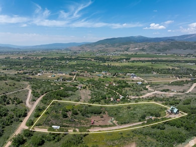 View of rural area featuring property boundaries highlighted and a mountain backdrop