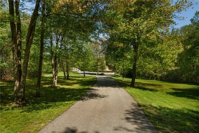 Private drive approach to this beautiful home.