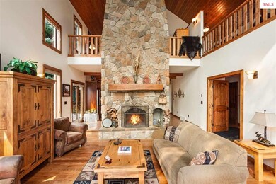 Wood burning stone fireplace anchors the room & ca