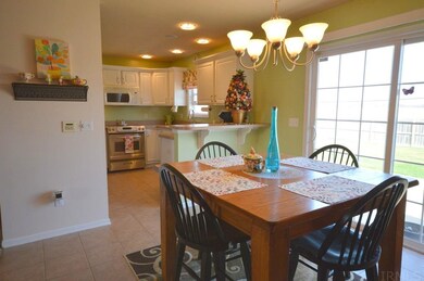 Dining area leading to private backyard.