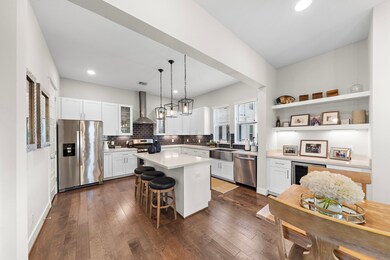 Modern kitchen featuring quartz counters and a dry