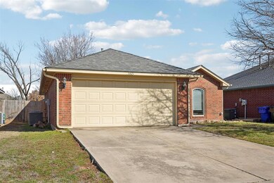 Ranch-style home featuring a front lawn, central A