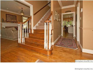 Living room to the right of the staircase and den 