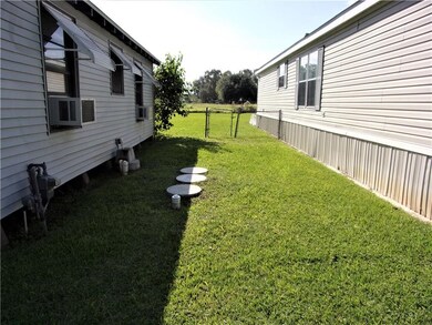Area between homes.  Septic system components show