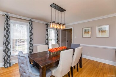 Formal Dining Room with Hardwoods and Updated Ligh
