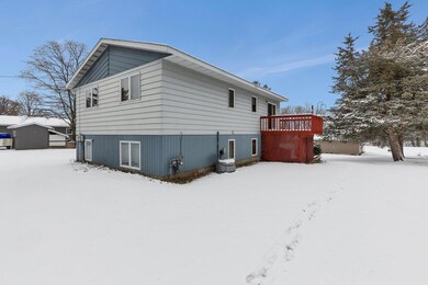 Sideview with deck overlooking the spacious backyard