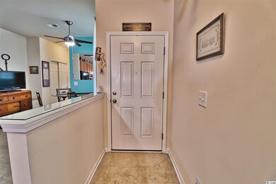 Enter into the tiled foyer through a full glass st