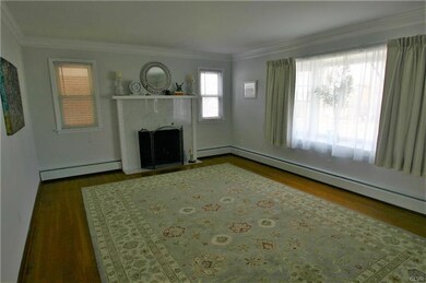 Living room with marble fireplace & oak floor