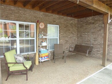 The covered patio is a perfect place to relax or entertain guests! 