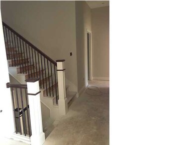 Stairs lead to great upstairs bonus room and basem