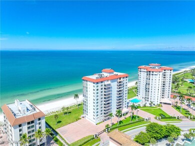 Bird's eye view of apartment complex and expansive beach
