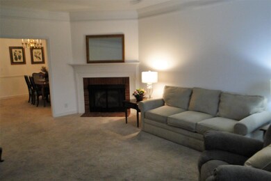 Great room with 10 ft ceiling, crown mold and fireplace