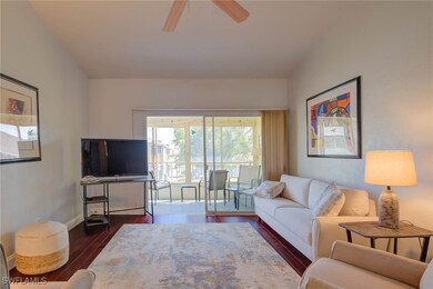 Living room featuring ceiling fan, baseboards, and