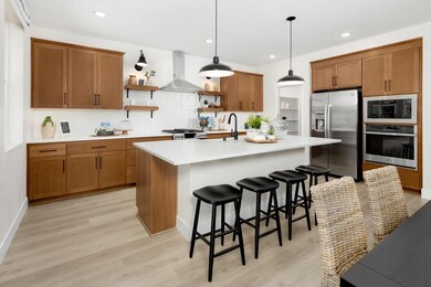 Kitchen with pendant lighting and floating shelves