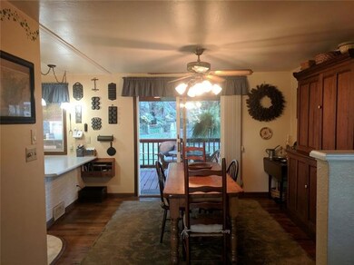 dining room shows maple hardwood that covers entir