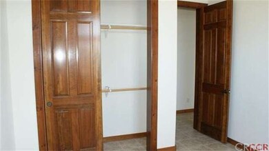 bedroom one, note the beautiful  ovrsized wood doo