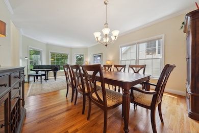 Living Room/Dining Room with hardwood floors and bay window