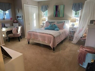 Bedroom featuring carpet floors and a closet