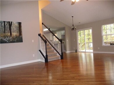 Open Floor Plan with Vaulted Ceilings and Custom Hardwood Floors