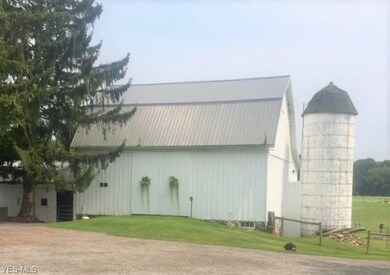 Well-maintained bank barn with attached and divide