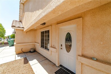 Property entrance with stucco siding