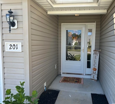 Doorway to property with a porch