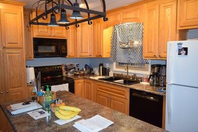 Spacious kitchen with island and eat-in area.  