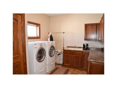 Laundry Area. Drop zone with cabinets, counters, t