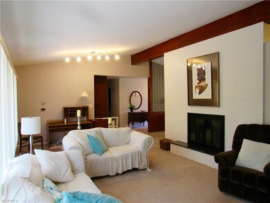 Vaulted ceiling great room with floor to ceiling f