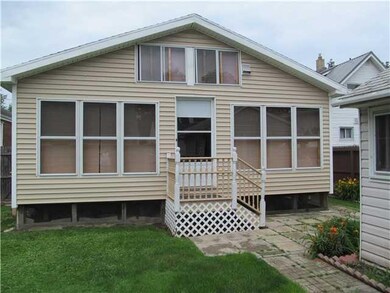 Exterior Back. This Florida Rom was added and is n